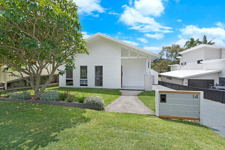 Coastal home exterior with garden and driveway