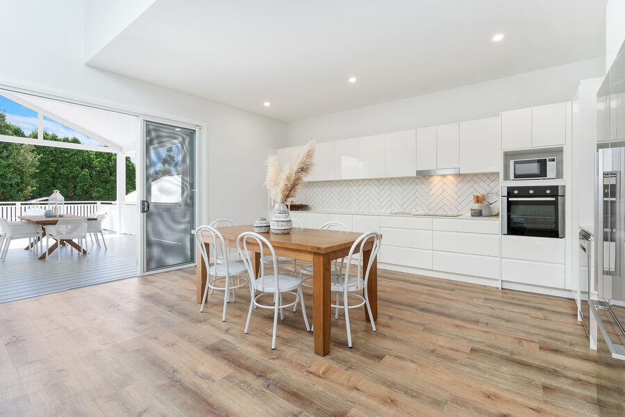 New kitchen with island, herringbone splashback and pendant lighting
